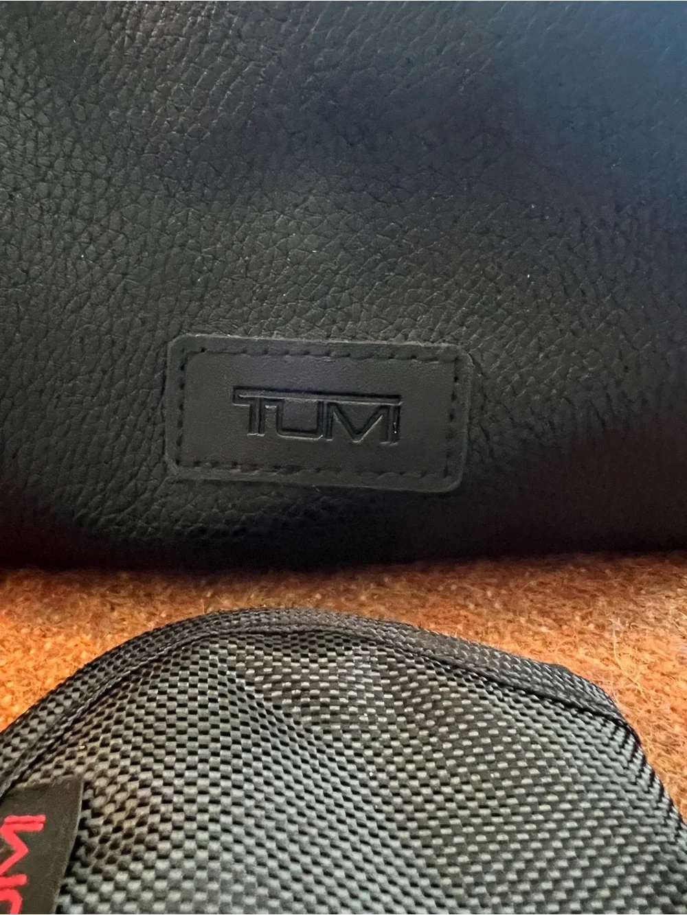 Tumi El Al Business Class Amenity Kit, featuring a black pebbled exterior